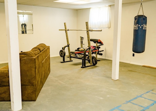 exercise room featuring a paneled ceiling