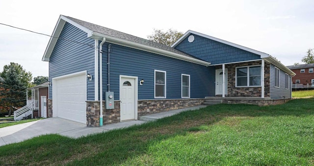 view of front of house with a garage and a front yard