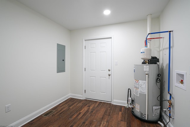 interior space with electric panel, dark wood-type flooring, washer hookup, and gas water heater