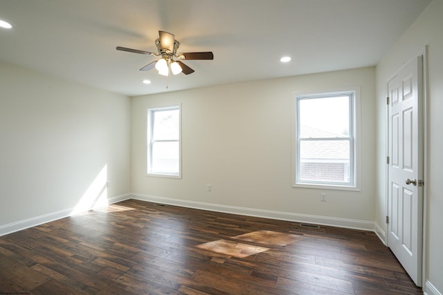 unfurnished room featuring dark hardwood / wood-style floors and ceiling fan