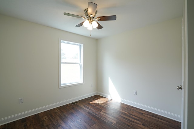 unfurnished room featuring ceiling fan and dark hardwood / wood-style floors