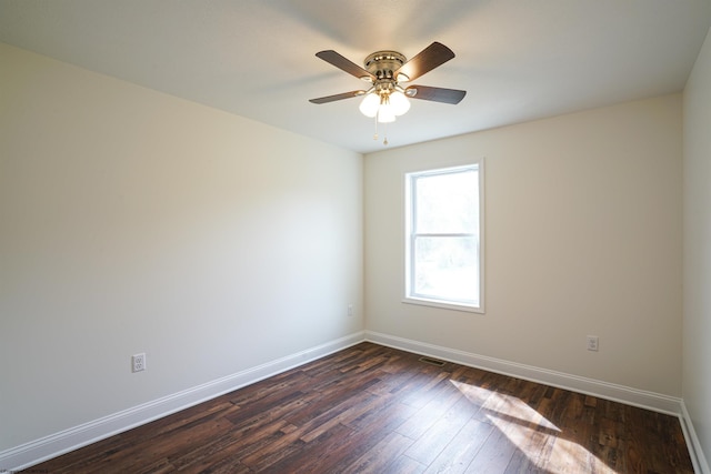 spare room with ceiling fan and dark hardwood / wood-style floors