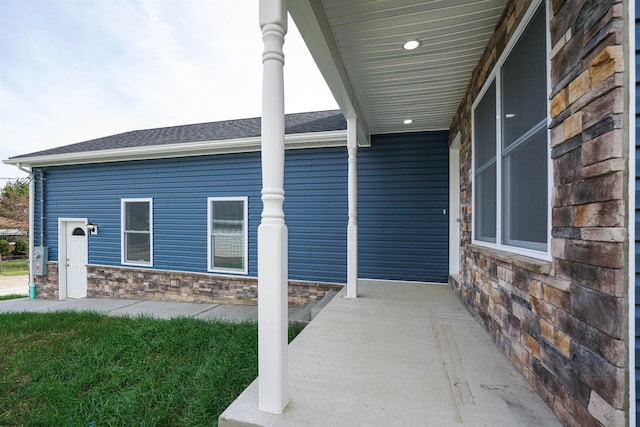 view of side of property featuring a porch