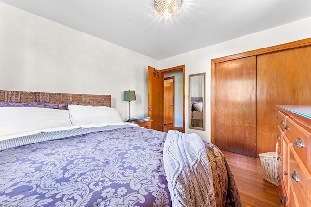 bedroom with hardwood / wood-style flooring and a closet