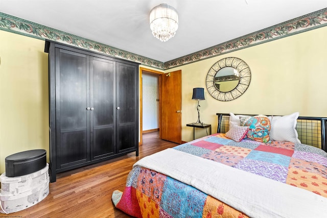 bedroom with hardwood / wood-style flooring