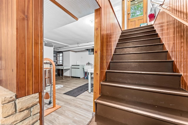 stairway with hardwood / wood-style flooring