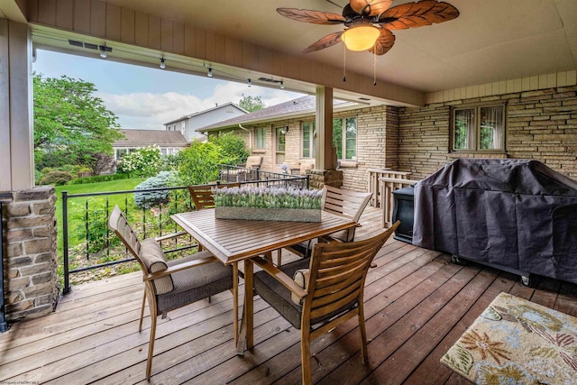 deck with area for grilling and ceiling fan