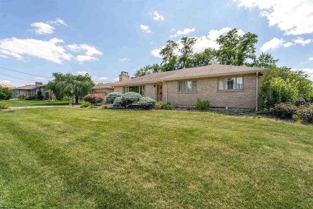 ranch-style home featuring a front yard