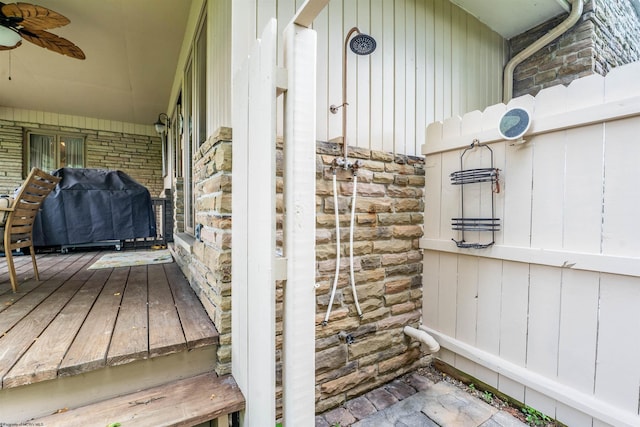 exterior space featuring ceiling fan