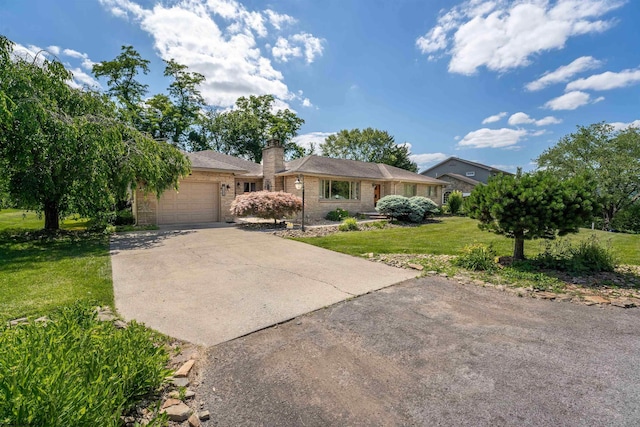 single story home featuring a front lawn and a garage