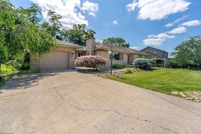 single story home featuring a front lawn and a garage