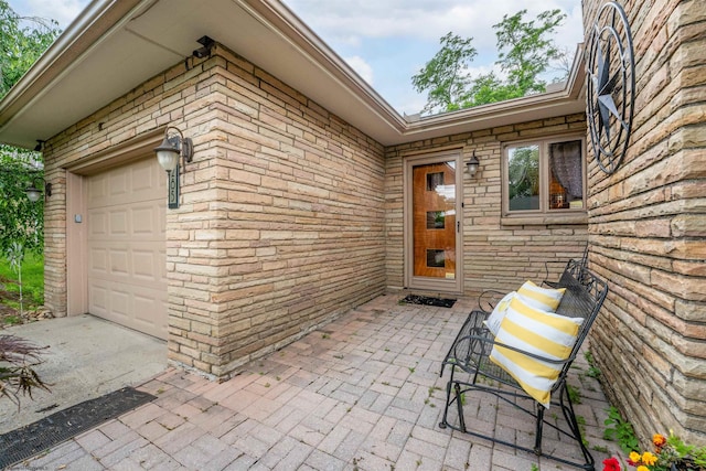 view of patio / terrace featuring a garage