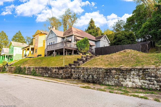 view of front of house with a wooden deck