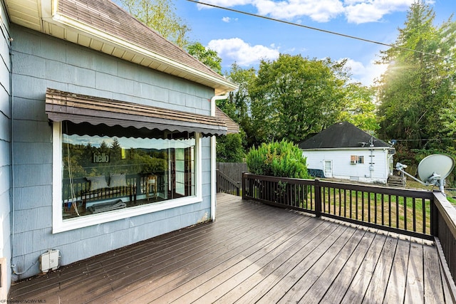 wooden deck featuring an outbuilding