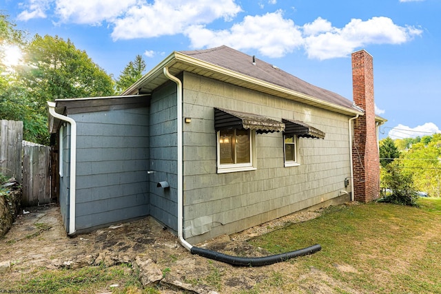 view of home's exterior featuring a yard