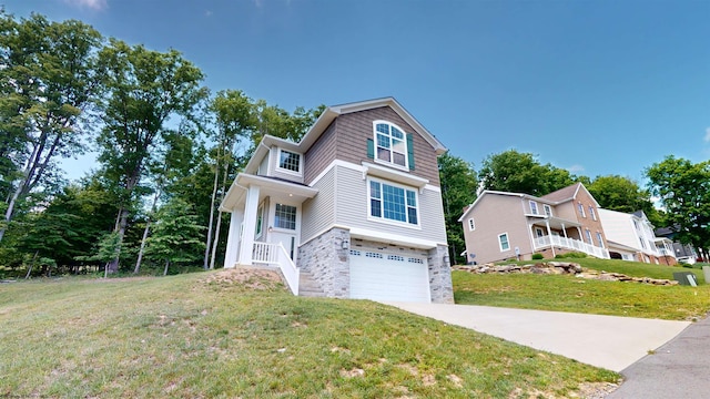 view of front of property featuring a front lawn and a garage