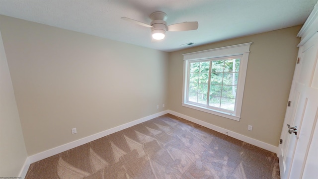 unfurnished room with light carpet and ceiling fan