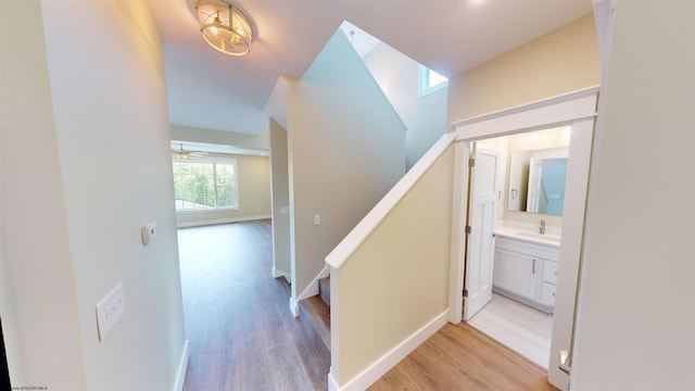 hallway featuring light hardwood / wood-style floors and sink