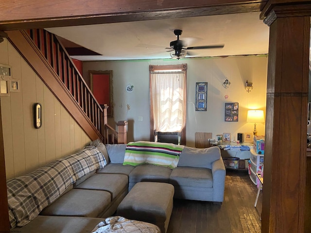 living room featuring ceiling fan and hardwood / wood-style floors