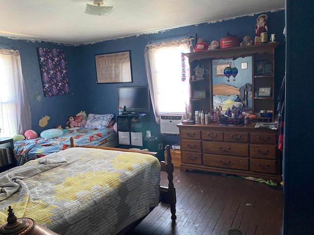 bedroom featuring hardwood / wood-style flooring