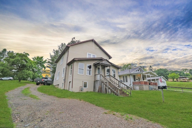 view of front of home with a yard