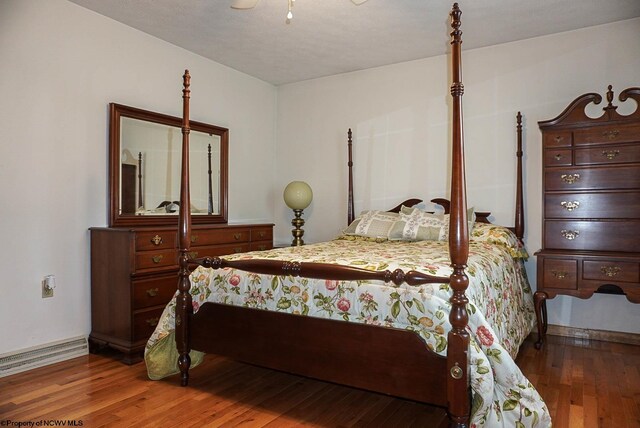 bedroom with hardwood / wood-style floors