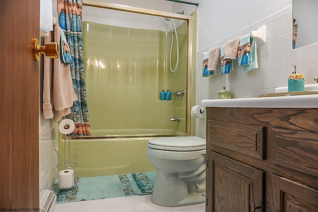 full bathroom featuring tile flooring, bath / shower combo with glass door, toilet, and tile walls