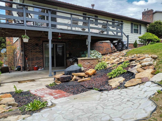 back of house with a patio area and a balcony