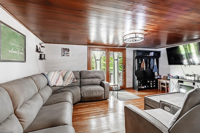 living room with light hardwood / wood-style flooring and wooden ceiling