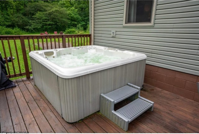 wooden terrace featuring a hot tub