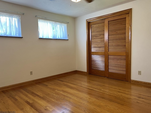 unfurnished room featuring ceiling fan and light wood-type flooring