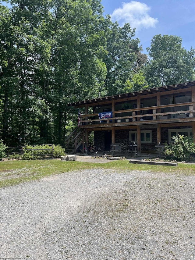 view of front of property with a wooden deck