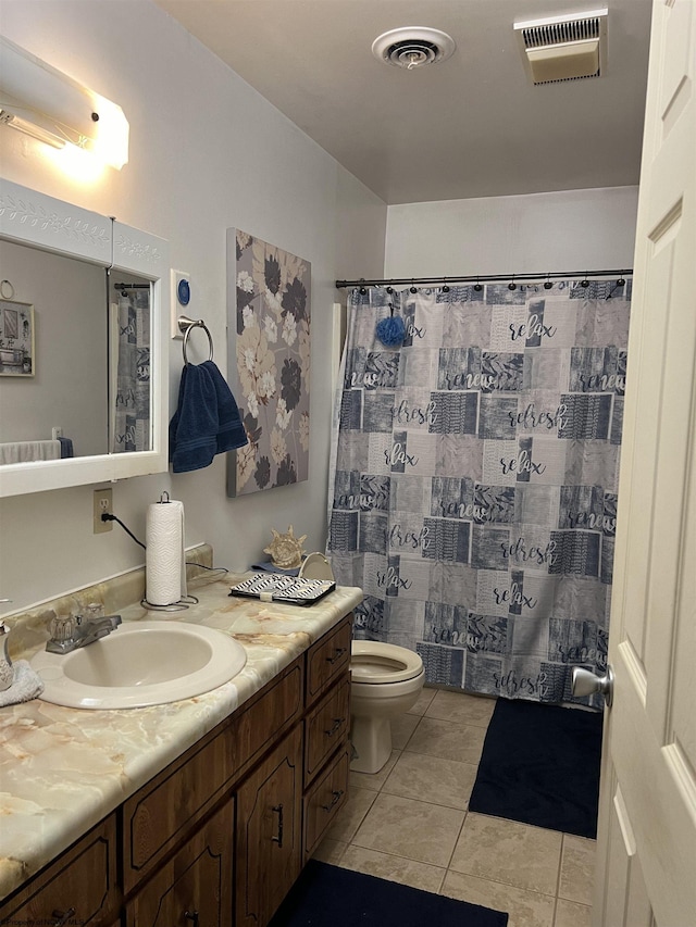 bathroom featuring tile patterned floors, vanity, toilet, and a shower with shower curtain