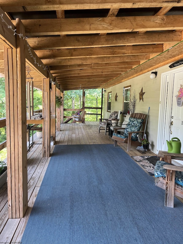 wooden terrace featuring a porch