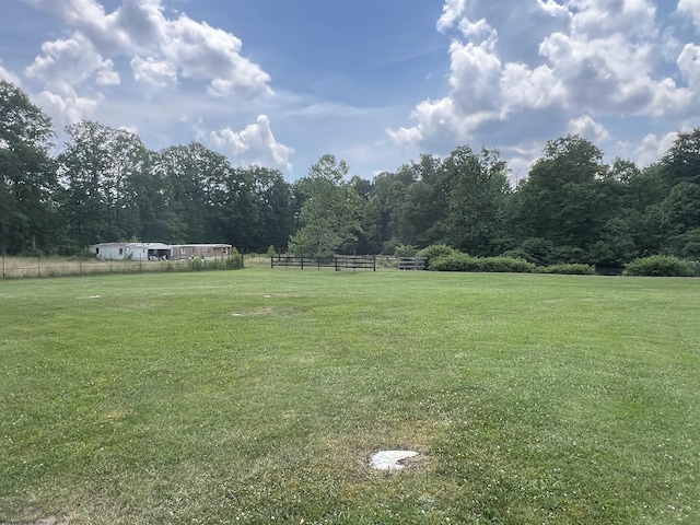 view of yard with a rural view