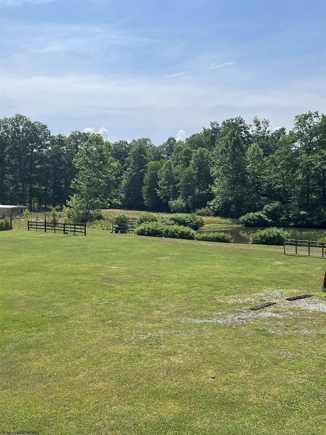 view of yard with a rural view