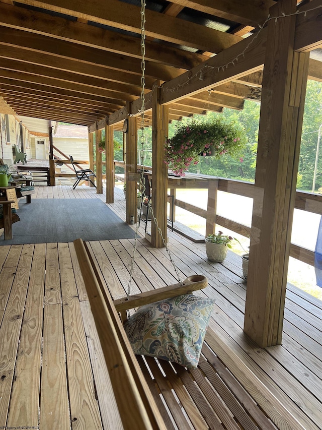 wooden deck featuring covered porch