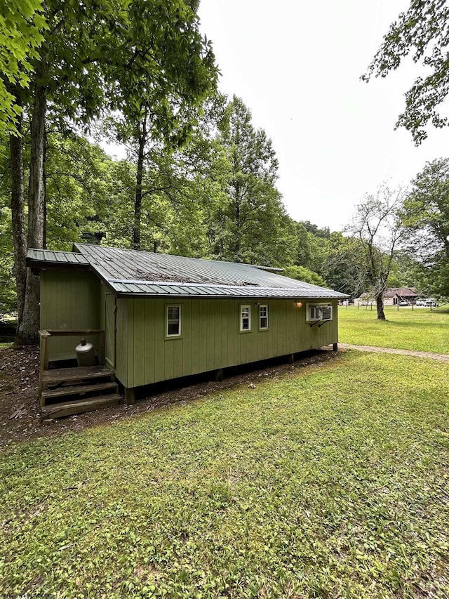 view of property exterior featuring a lawn