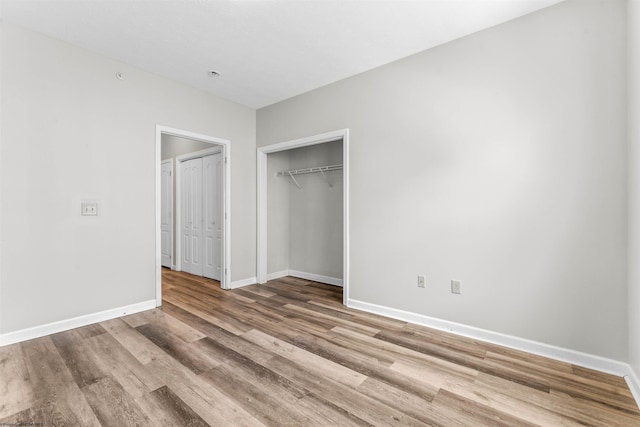 unfurnished bedroom with light wood-type flooring