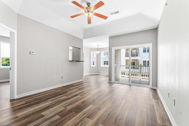 unfurnished living room with ceiling fan and dark hardwood / wood-style floors