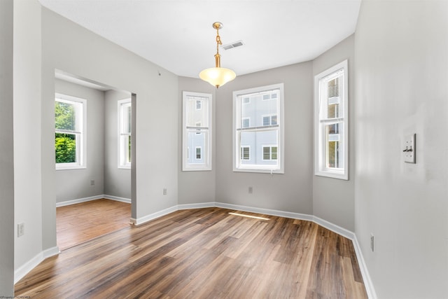 spare room featuring hardwood / wood-style floors