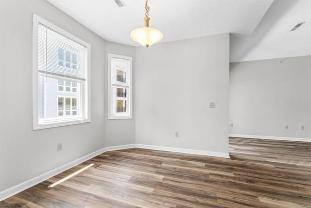 spare room featuring hardwood / wood-style flooring