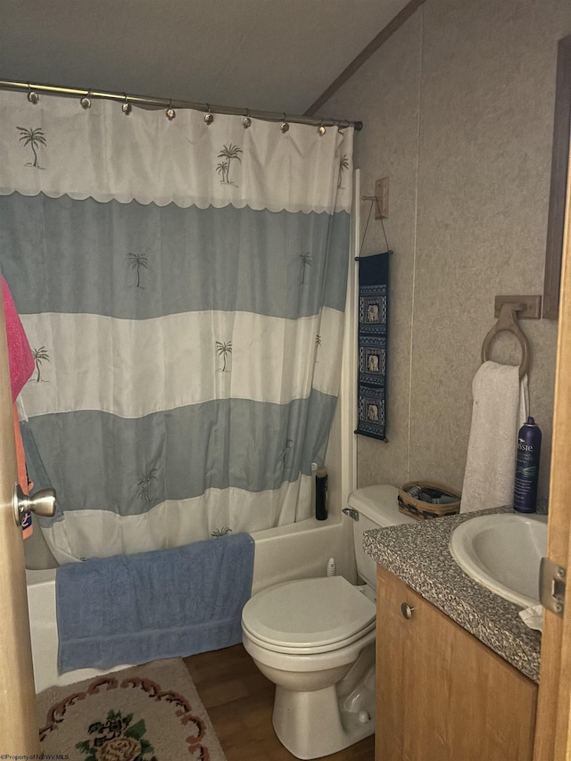 full bathroom with vanity, hardwood / wood-style flooring, toilet, and shower / bathtub combination with curtain