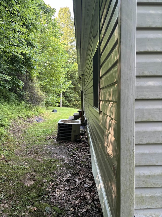 view of property exterior with central AC unit