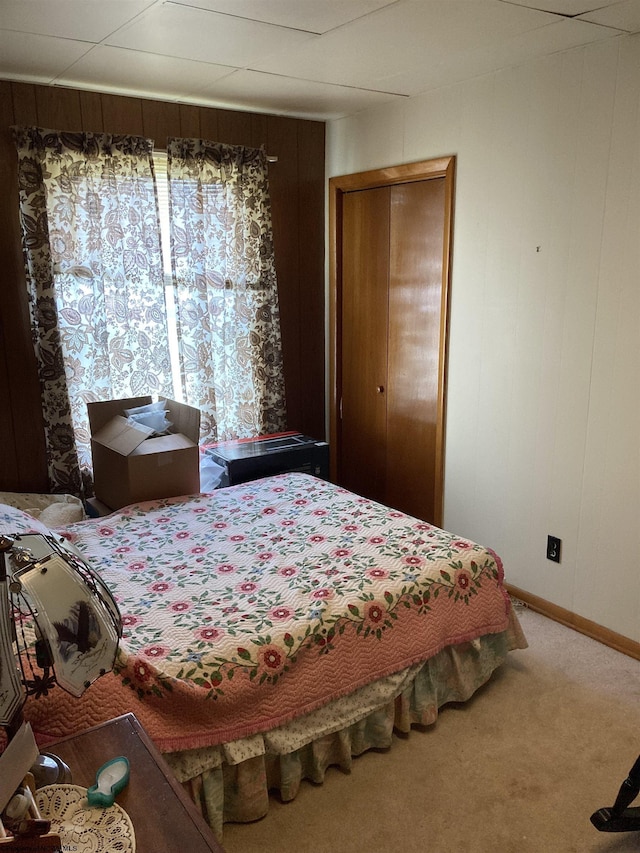 bedroom with carpet flooring and a closet