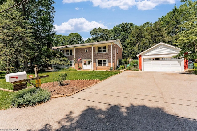 split foyer home with a garage and a front yard