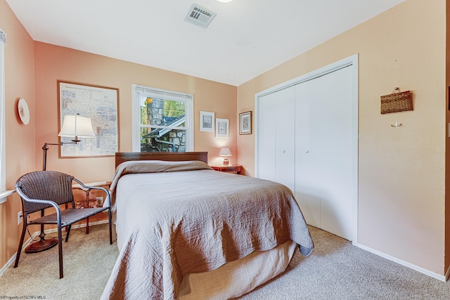 bedroom featuring a closet and carpet floors