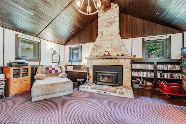 living room with an inviting chandelier, wood-type flooring, a stone fireplace, wood ceiling, and vaulted ceiling