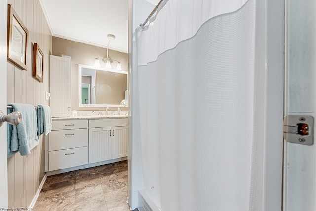 bathroom with tile floors, ornamental molding, and oversized vanity