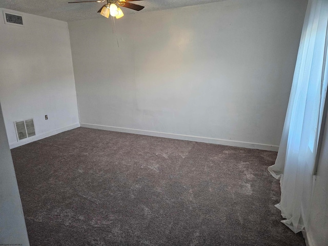 empty room with carpet floors, a textured ceiling, and ceiling fan